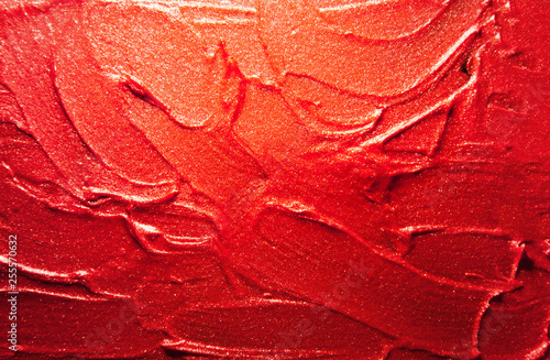 Glitter lipstick smeard background classic red