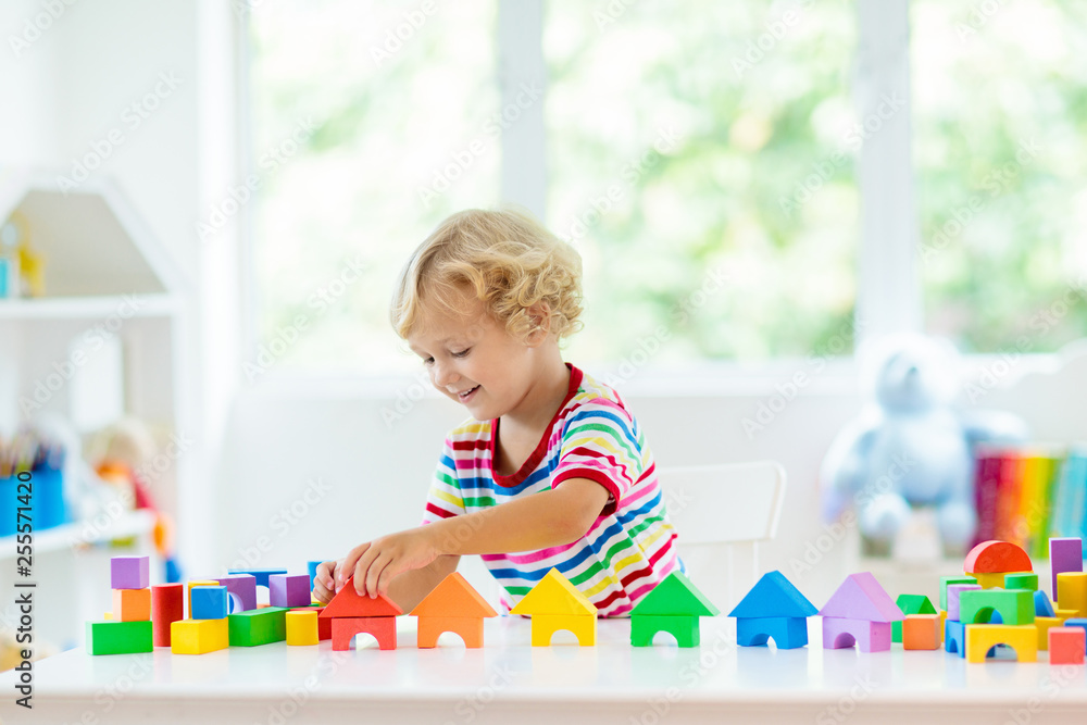 Kids toys. Child building tower of toy blocks. Kids toys. Child building tower of toy blocks.