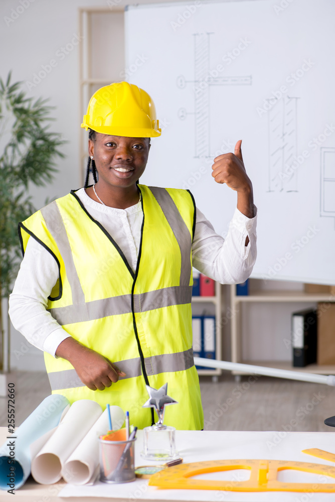 Young black architect working on project Young black architect working on project