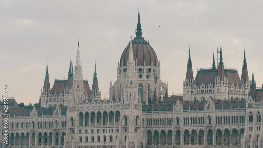 The world-famous building of the Hungarian Parliament in Budapest in the Gothic style in cloudy weather The world-famous building of the Hungarian Parliament in Budapest in the Gothic style in cloudy weather