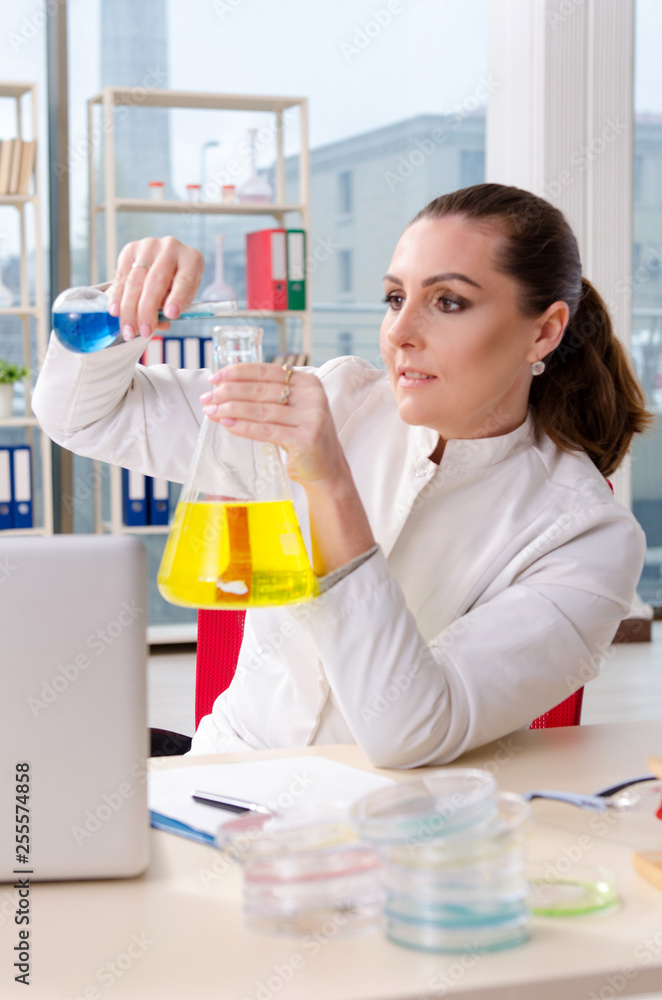 Female biotechnology scientist chemist working in the lab Female biotechnology scientist chemist working in the lab