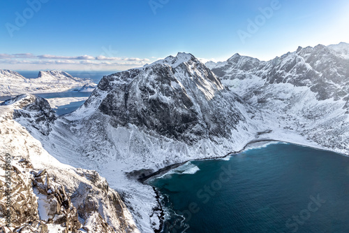 View from the slope of Mount Ryten down to Kvalvika Beach on the Lofoten Islands in Norway in winter © Nils