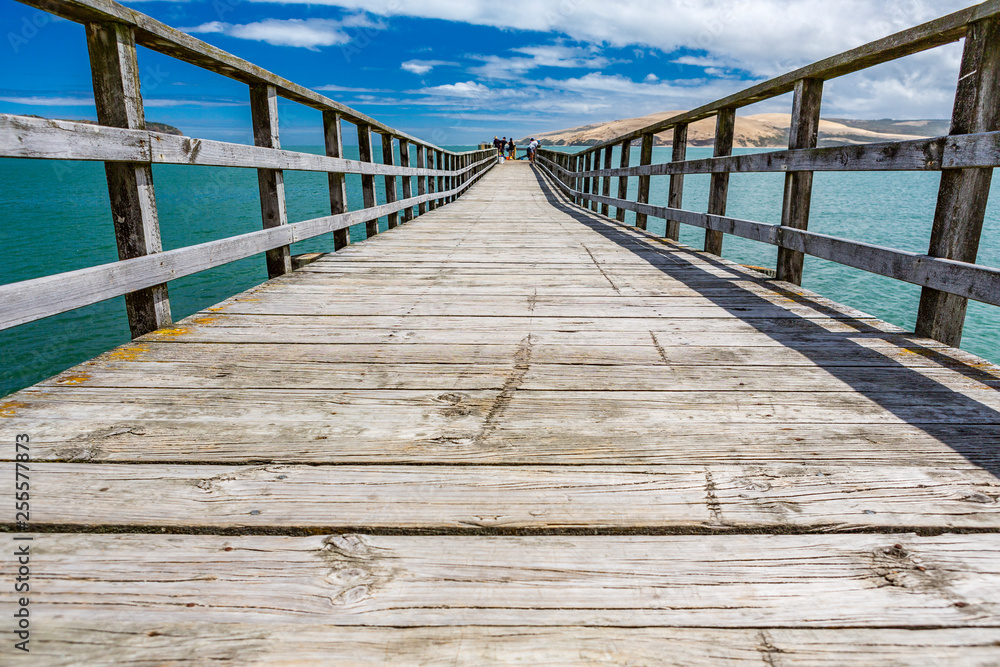 Jetty in Omapere Northland, blue sky, New Zealand Jetty in Omapere Northland, blue sky, New Zealand