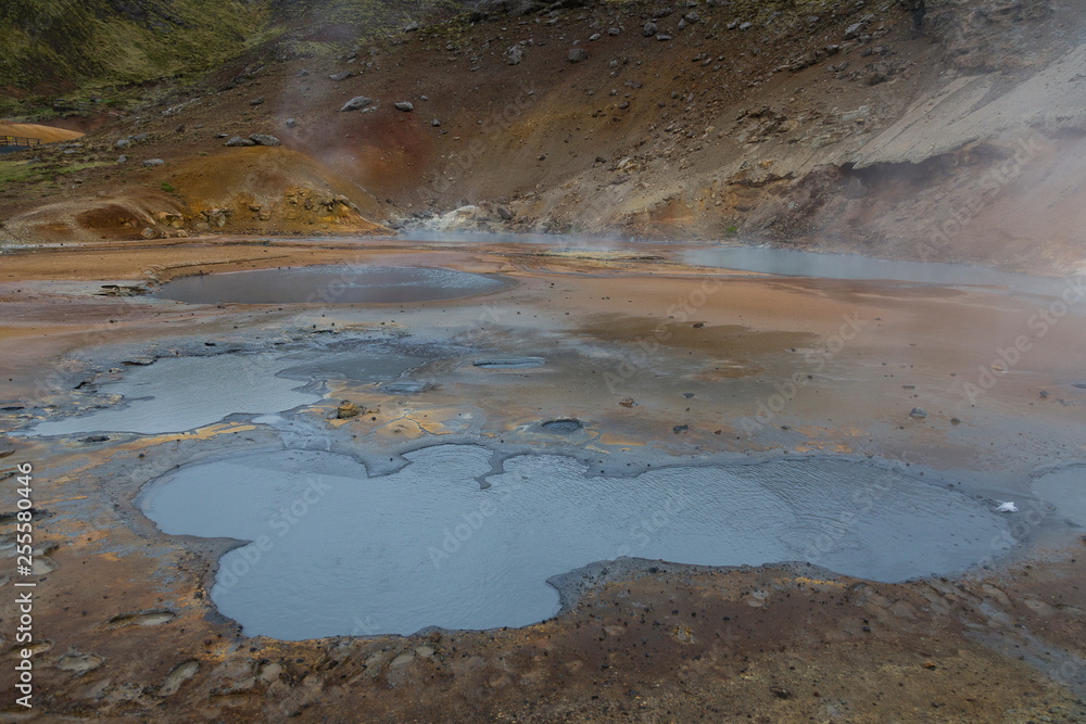 Large steamy blue gray mud pots in Seltun, Iceland Large steamy blue gray mud pots in Seltun, Iceland