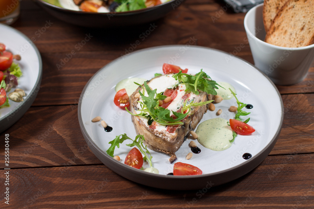 Appetizer of eggplant, Kalamata olives, green onions and cottage cheese. Mediterranean snack. Vegan health food Appetizer of eggplant, Kalamata olives, green onions and cottage cheese. Mediterranean snack. Vegan health food