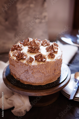 Homemade Kiev cake, dacquoise cake with butter cream and hazelnuts.