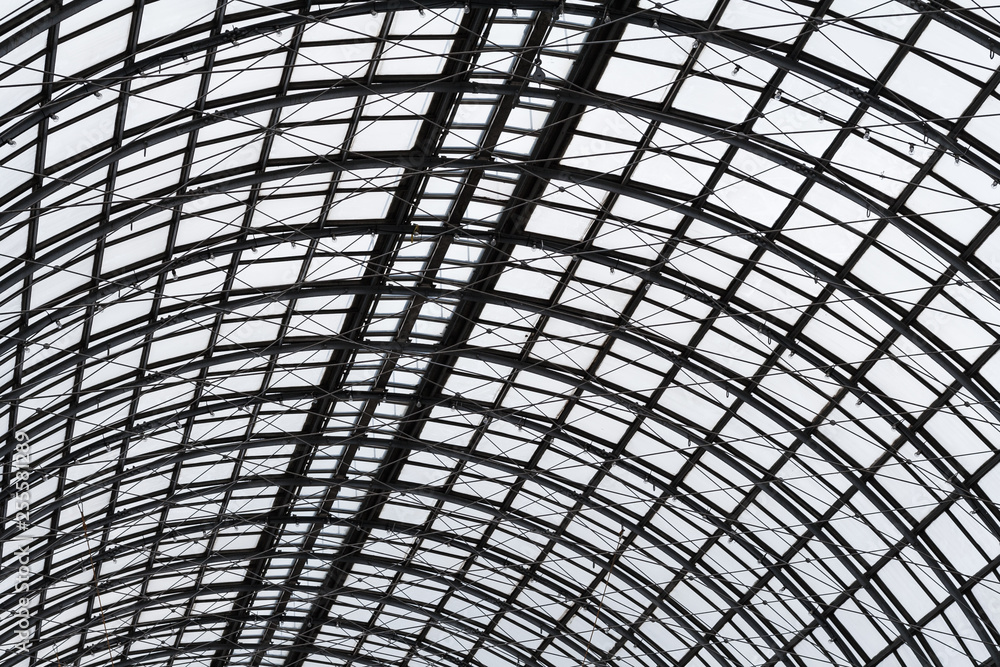 Abstract view to hemispherical ceiling of glass and metal in modern building as background, texture