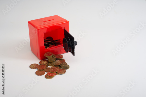box with coins isolated on white background