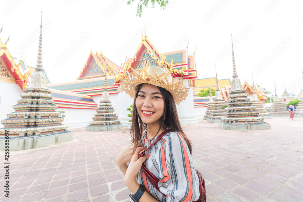 Asian beautiful women travel in buddha temple Wat Pho