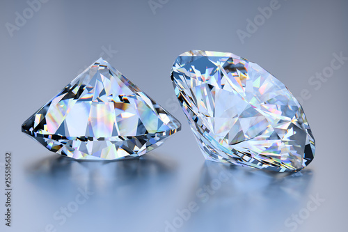 Two big round cut diamonds on blue glossy background