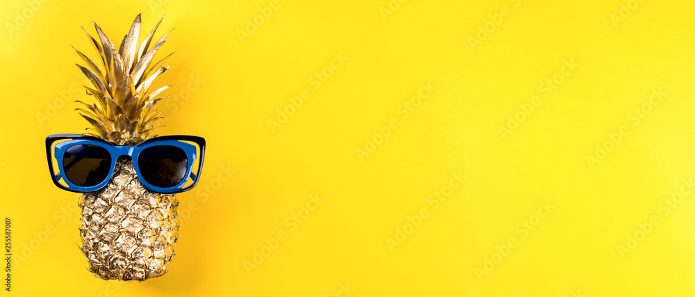 Creative layout made gold pineapple on brightly yellow background.Minimal style. Tropical Food concept.Summer Idea .Copy space for Text. Creative layout made gold pineapple on brightly yellow background.Minimal style. Tropical Food concept.Summer Idea .Copy space for Text.