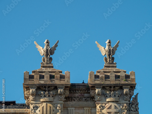 Statue of monster above the Agencia Estatal de Administración Tributaria (AEAT), commonly known as Agencia Tributaria is the revenue service of the Kingdom of Spain. photo