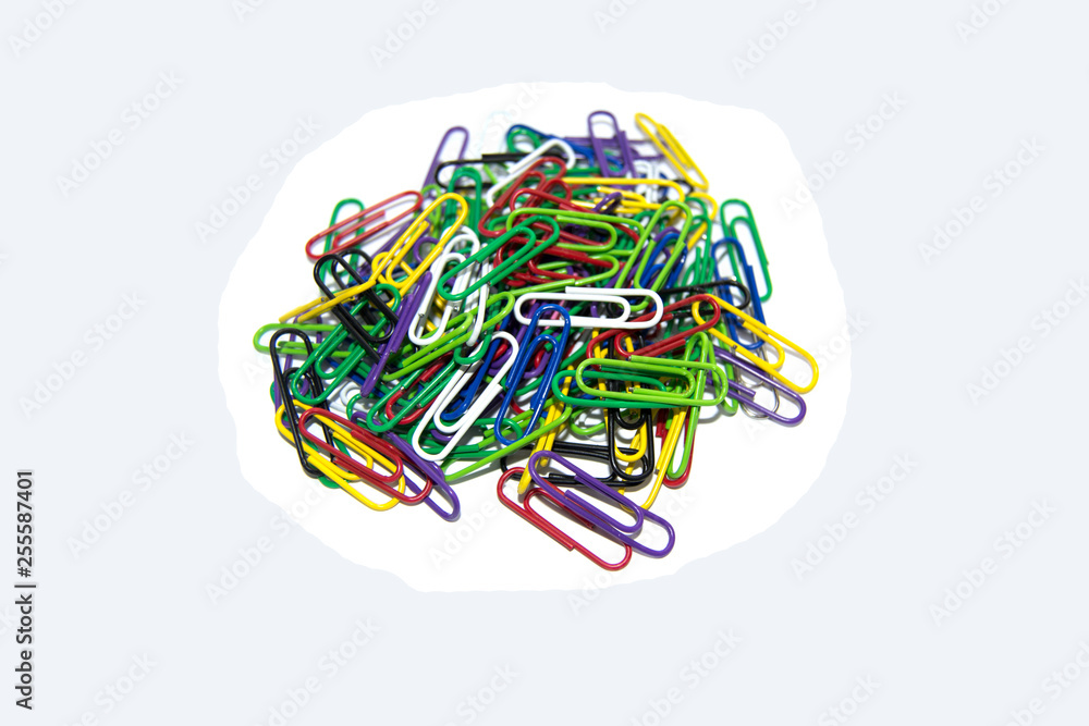 A pile of colored paper clips on a white background
