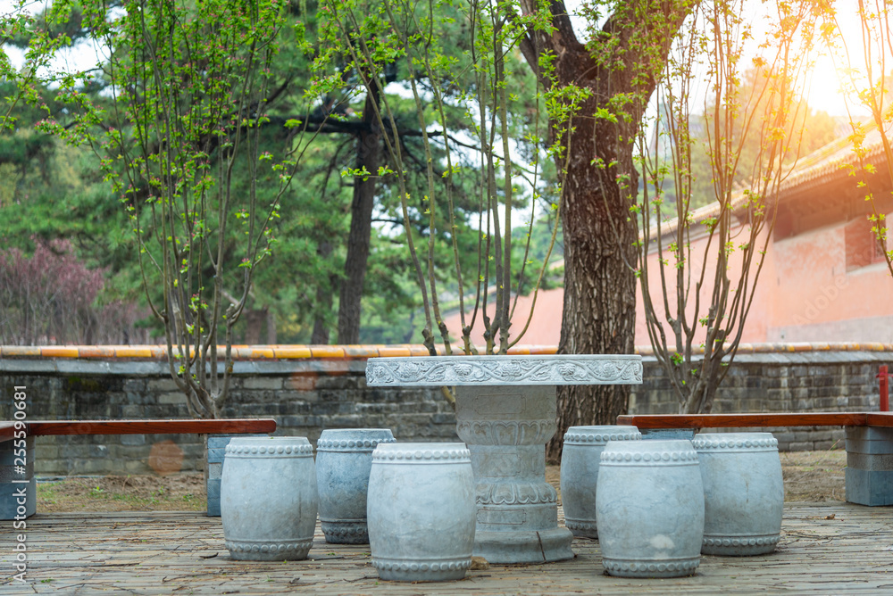 Stone made furniture at the courtyard of Asian traditional garden