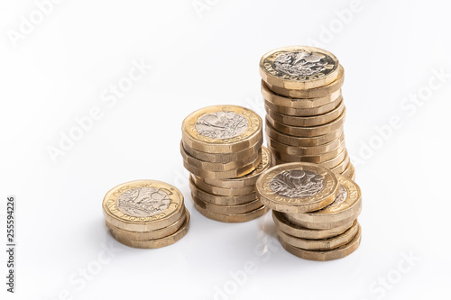 UK money, pound coins in small piles
