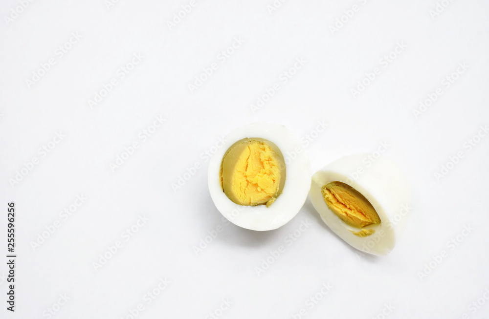 boiled egg and yolk half cut on white background