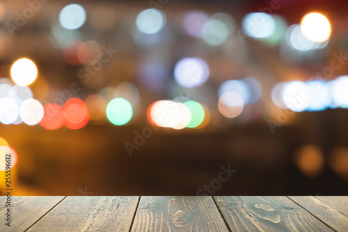 Wooden table on front blurred colorful bokeh background, for presentation and template product