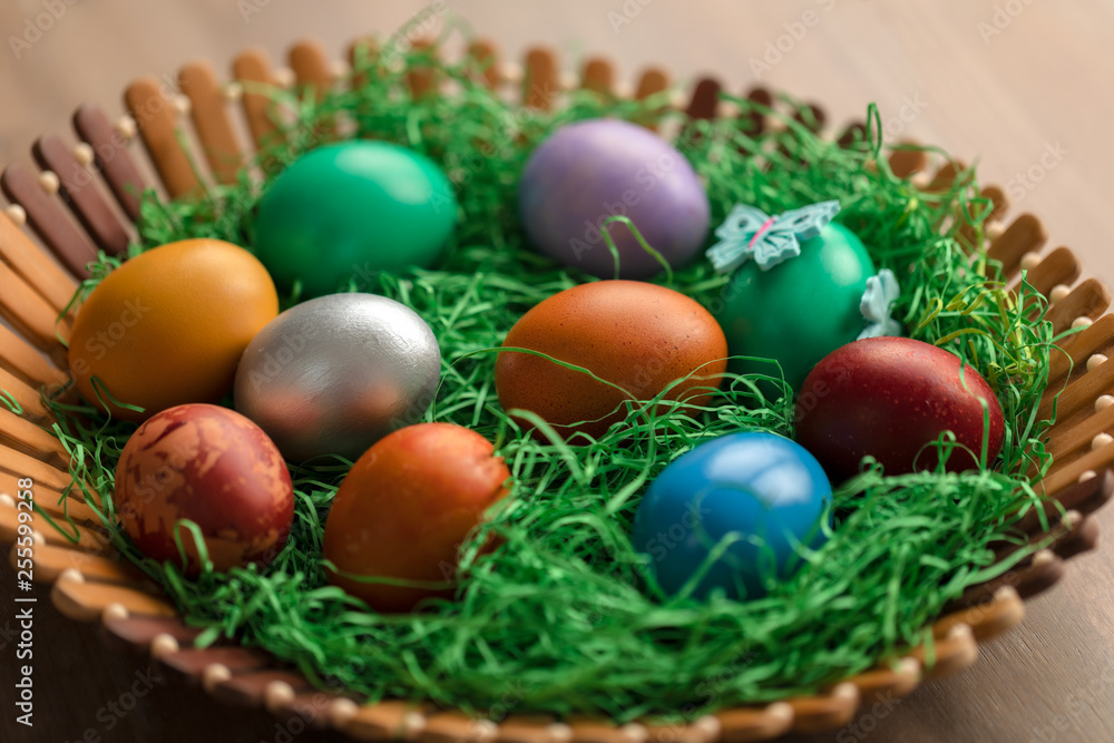 Colorful easter eggs in basket Colorful easter eggs in basket
