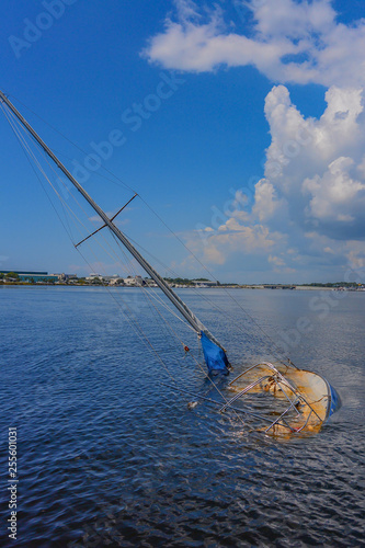 Sunken sailboat in Florida in a beautiful blue water 