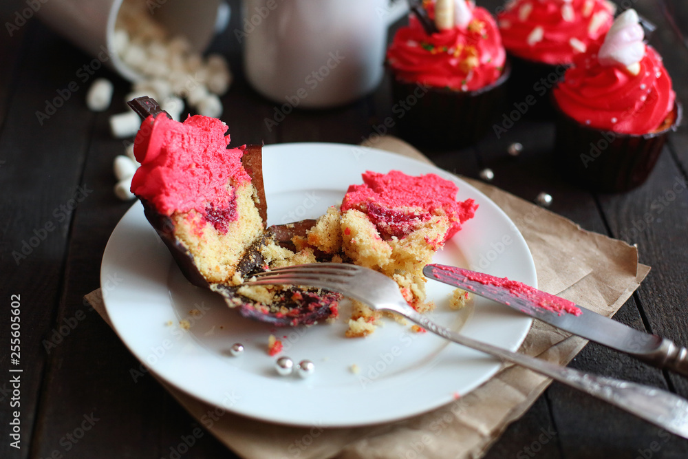 cupcakes with red cream on grey background