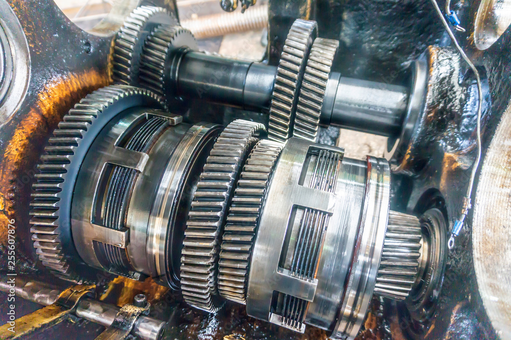 Disassembled gearbox for clutch repair and gears. Transmission for industrial machines and units disassembled. Disassembled gearbox for clutch repair and gears. Transmission for industrial machines and units disassembled.