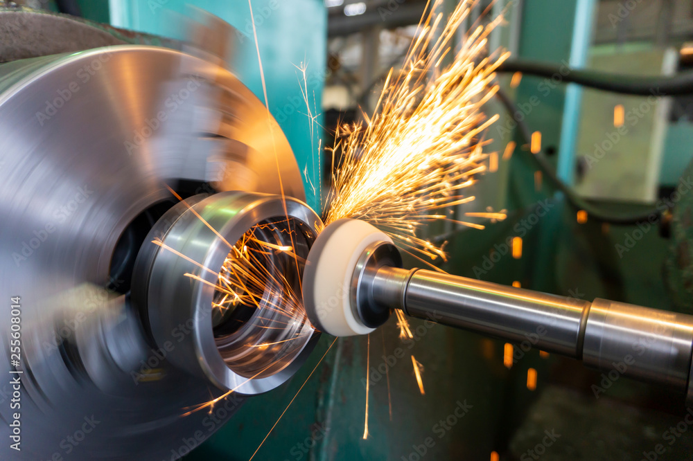 Grinding Processing End processing of a metal surface with an abrasive stone on a circular ...