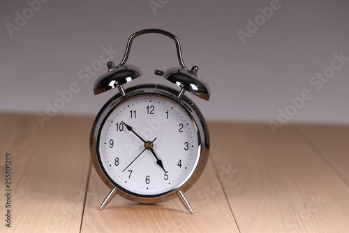 The old alarm clock on a light background