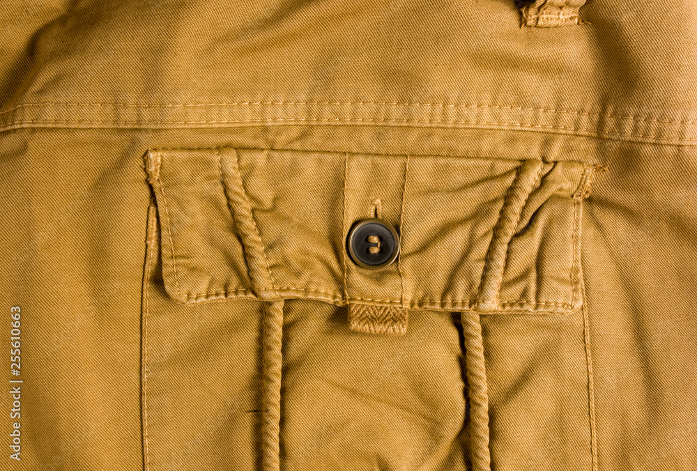 clothing items washed cotton fabric texture with seams, clasps, buttons and rivets clothing items washed cotton fabric texture with seams, clasps, buttons and rivets