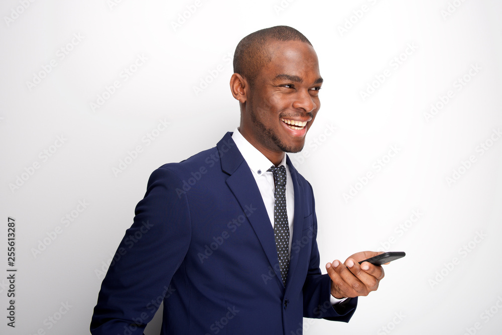 Side of young african american businessman with mobile phone Side of young african american businessman with mobile phone