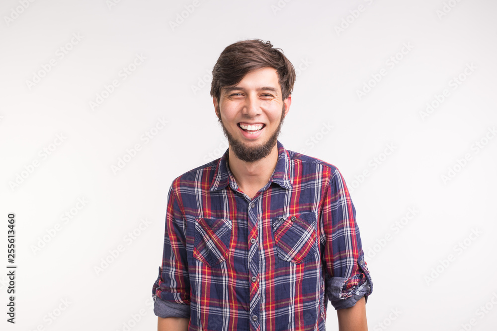 Portrait of happy bearded smiling laughing man on white background
