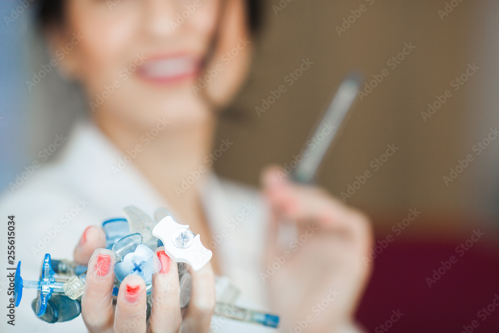 Doctor with a syrenge. Nurse going to do an ingection. Syringe in the hands closeup. Doctor with a syrenge. Nurse going to do an ingection. Syringe in the hands closeup.