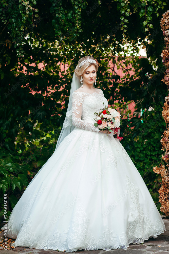 Portrait of a young beautiful bride with a bouquet Portrait of a young beautiful bride with a bouquet