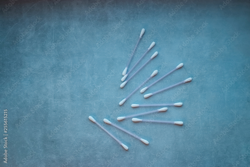 Cotton buds on gray background. Copy space. Cotton buds on gray background. Copy space.