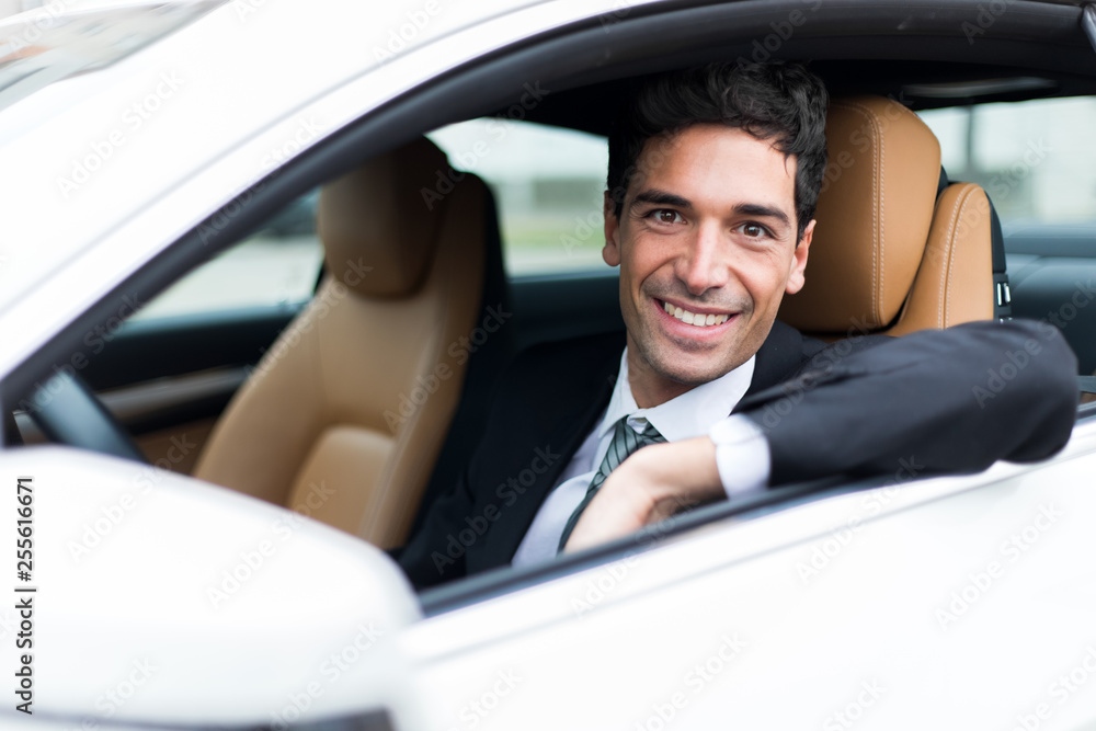 Handsome man driving his car Handsome man driving his car