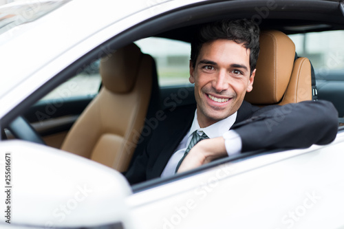 Handsome man driving his car © Minerva Studio