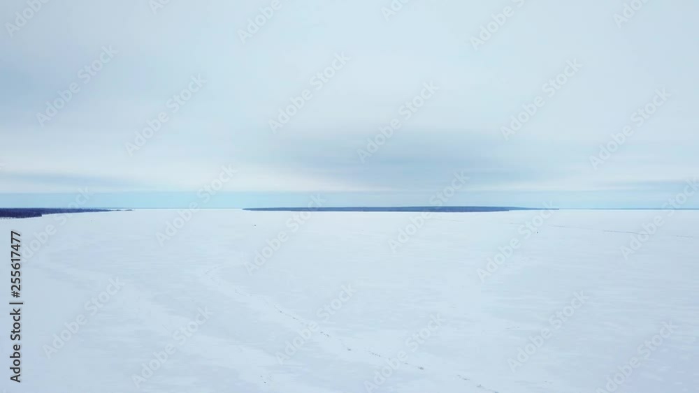 AERIAL: 4K drone aerial of frozen Lake Winnipeg in Manitoba, Canada and a large pressure ridge running along the south basin. Ice ridge is near Hecla, Gull Island, and Riverton. AERIAL: 4K drone aerial of frozen Lake Winnipeg in Manitoba, Canada and a large pressure ridge running along the south basin. Ice ridge is near Hecla, Gull Island, and Riverton.