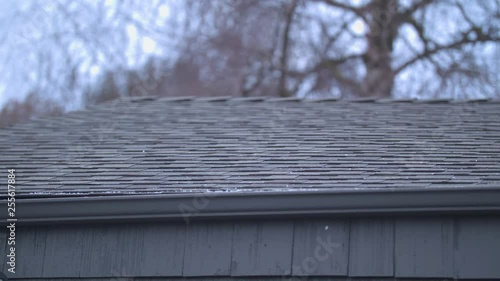 Hail Rolling off the Roof of a House