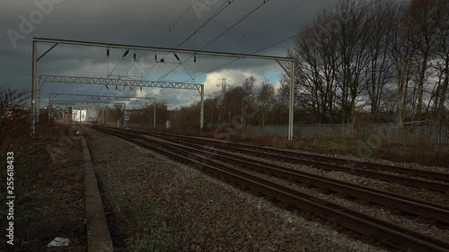 Footage of train lines, railway lines, tracks  approaching Stoke on Trent train station in the midlands by the canal, waterside and A50 motorway photo