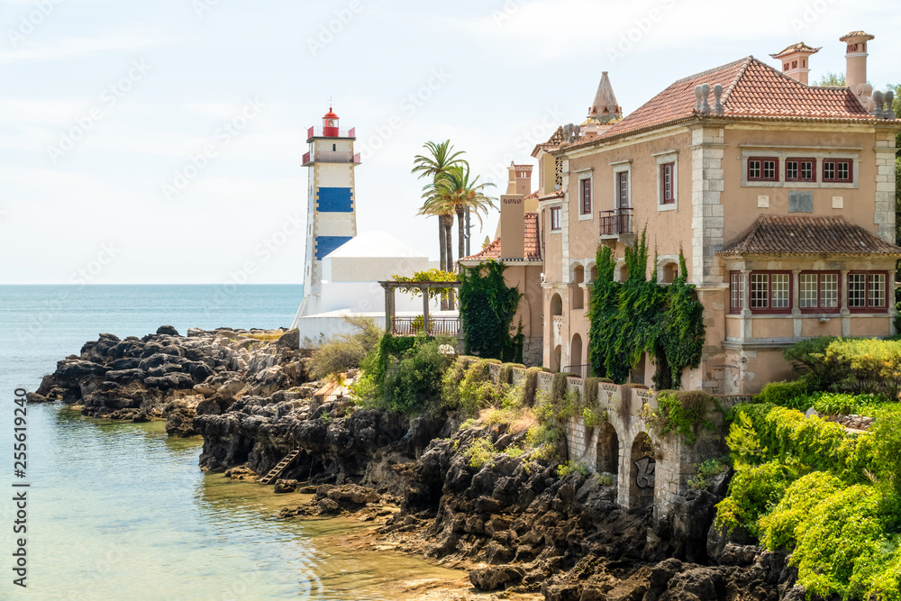 Old Portuguese Building And Lighthouse  Landscape Near The Ocean