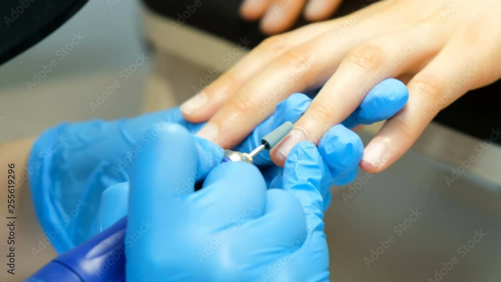 Manicure process, cleaning of nails by a milling cutter Manicure process, cleaning of nails by a milling cutter