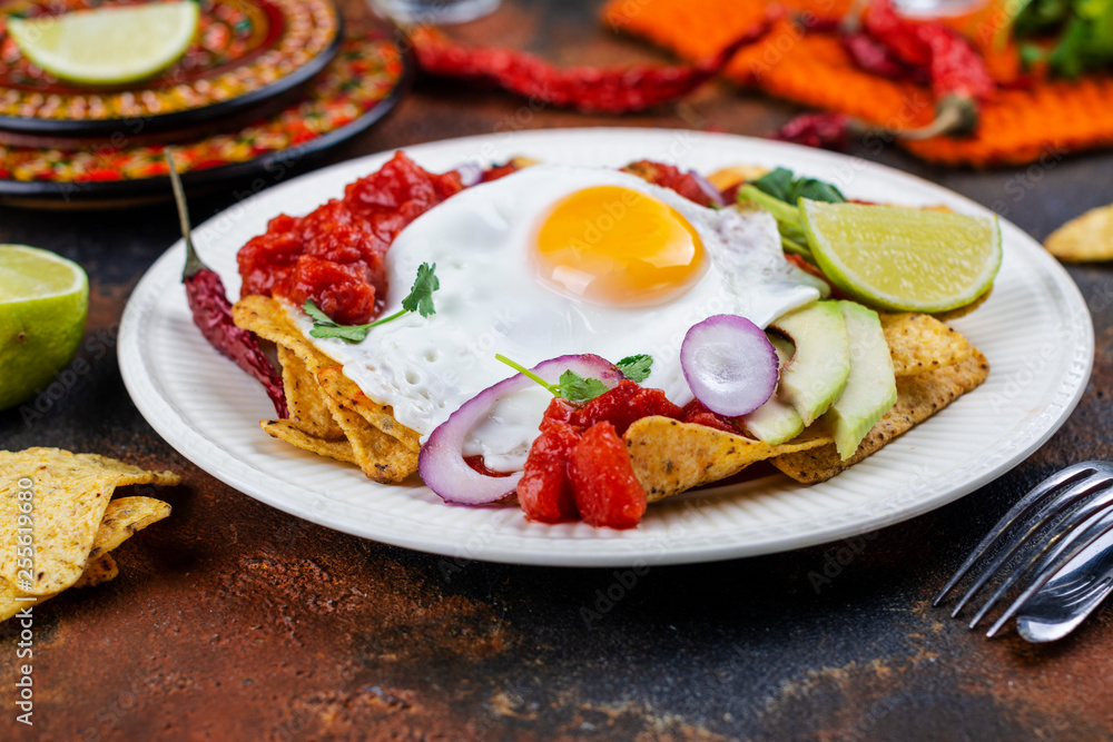 Mexican breakfast - chilaquiles dish Mexican breakfast - chilaquiles dish