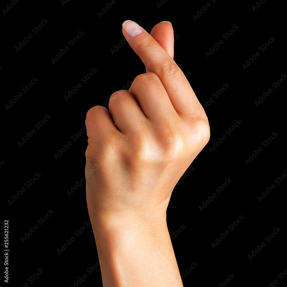 Woman hand holding something with two fingers Woman hand holding something with two fingers