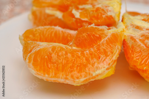 Slice of fresh orange fruit. Macro shoot of fresh orange. Orange background