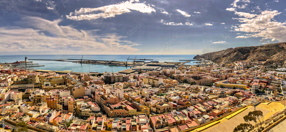 Panoramic cityscape of Almeria, Spain, and the Mediterranean sea; high angle view.
