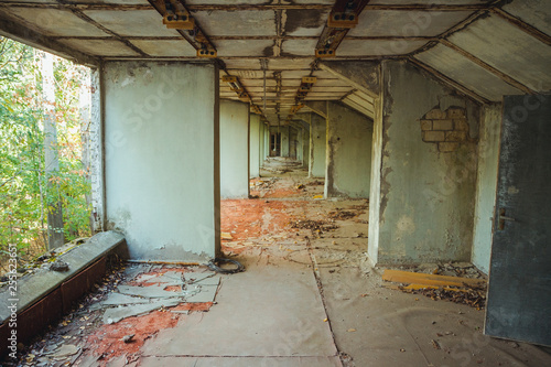 Old football stadium in Chornobyl exclusion zone. Radioactive zone in Pripyat city - abandoned ghost town. Chernobyl history of catastrophe