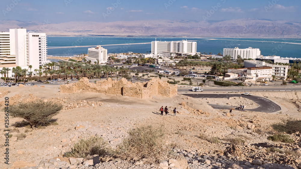 an ancient roman fort sits on the mountainside above the resort hotel on the dead sea in ein boqeq in israel an ancient roman fort sits on the mountainside above the resort hotel on the dead sea in ein boqeq in israel