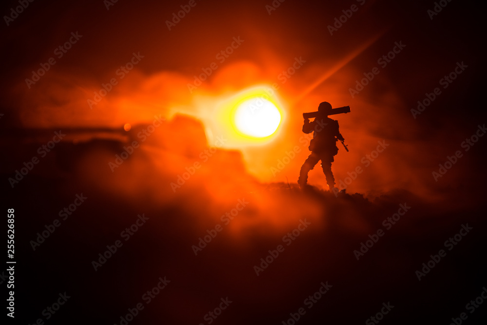 Military soldier silhouette with bazooka. War Concept. Military silhouettes fighting scene on war fog sky background, Soldier Silhouette aiming to the target at night Military soldier silhouette with bazooka. War Concept. Military silhouettes fighting scene on war fog sky background, Soldier Silhouette aiming to the target at night