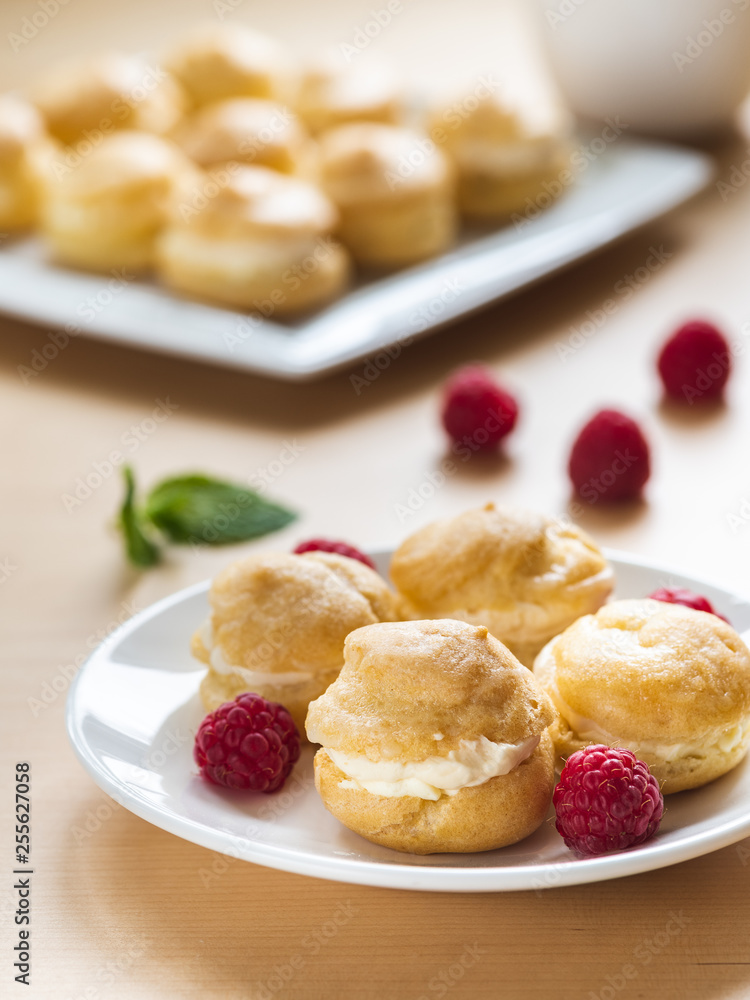 Profiterole on white plate Profiterole on white plate
