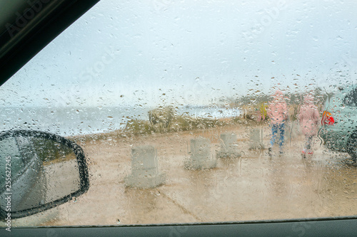 Rainy spring weather. Weather forecast. View through the car window. photo