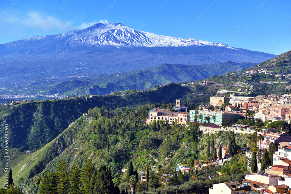 Obraz premium Mount Etna volcano viewed from the town and countryside of Taormina in Sicily, Italy